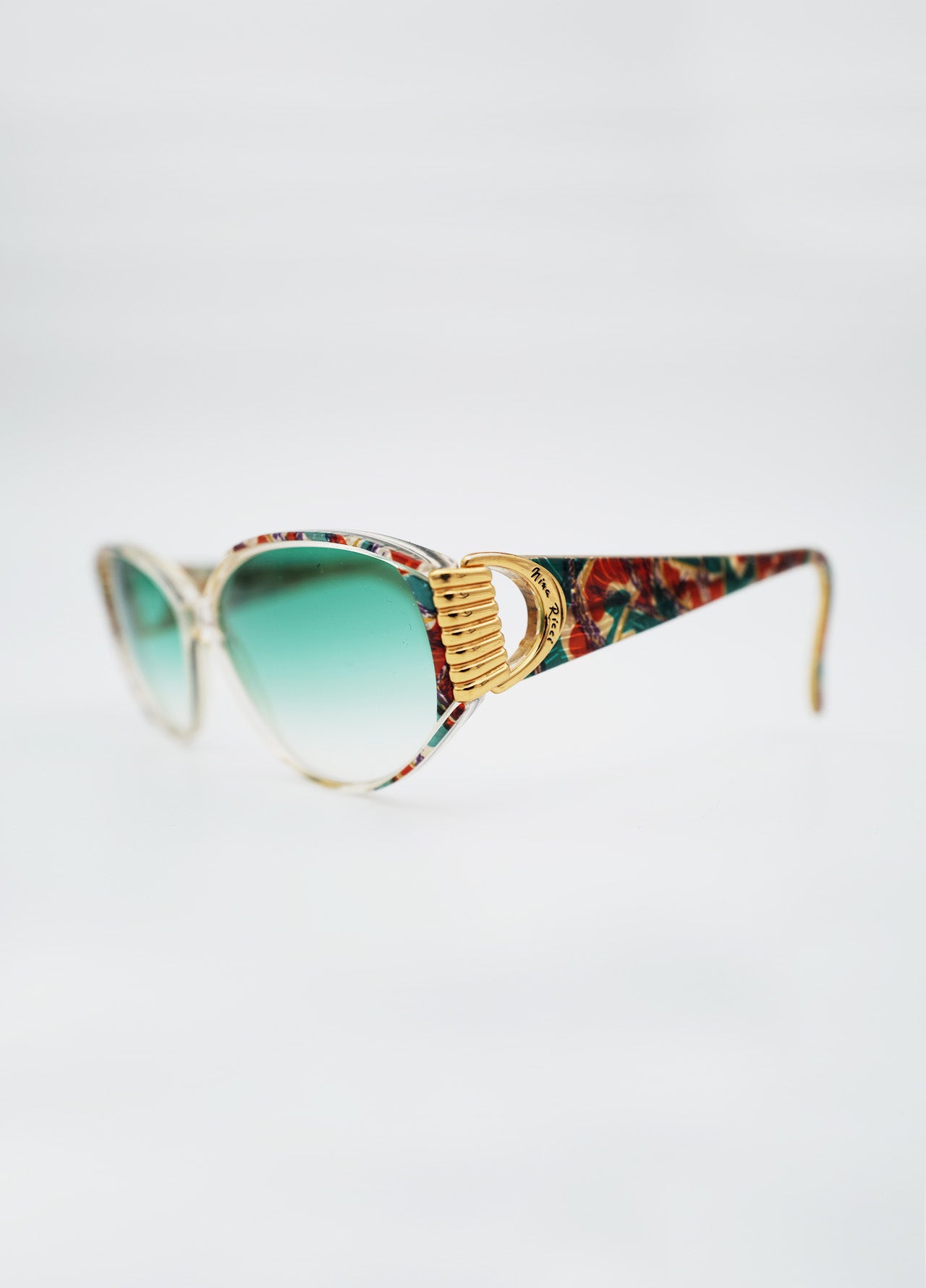 Lunette-Solaire-NinaRicci-Dore-Verre-Bleu-Motif-Vintage-01