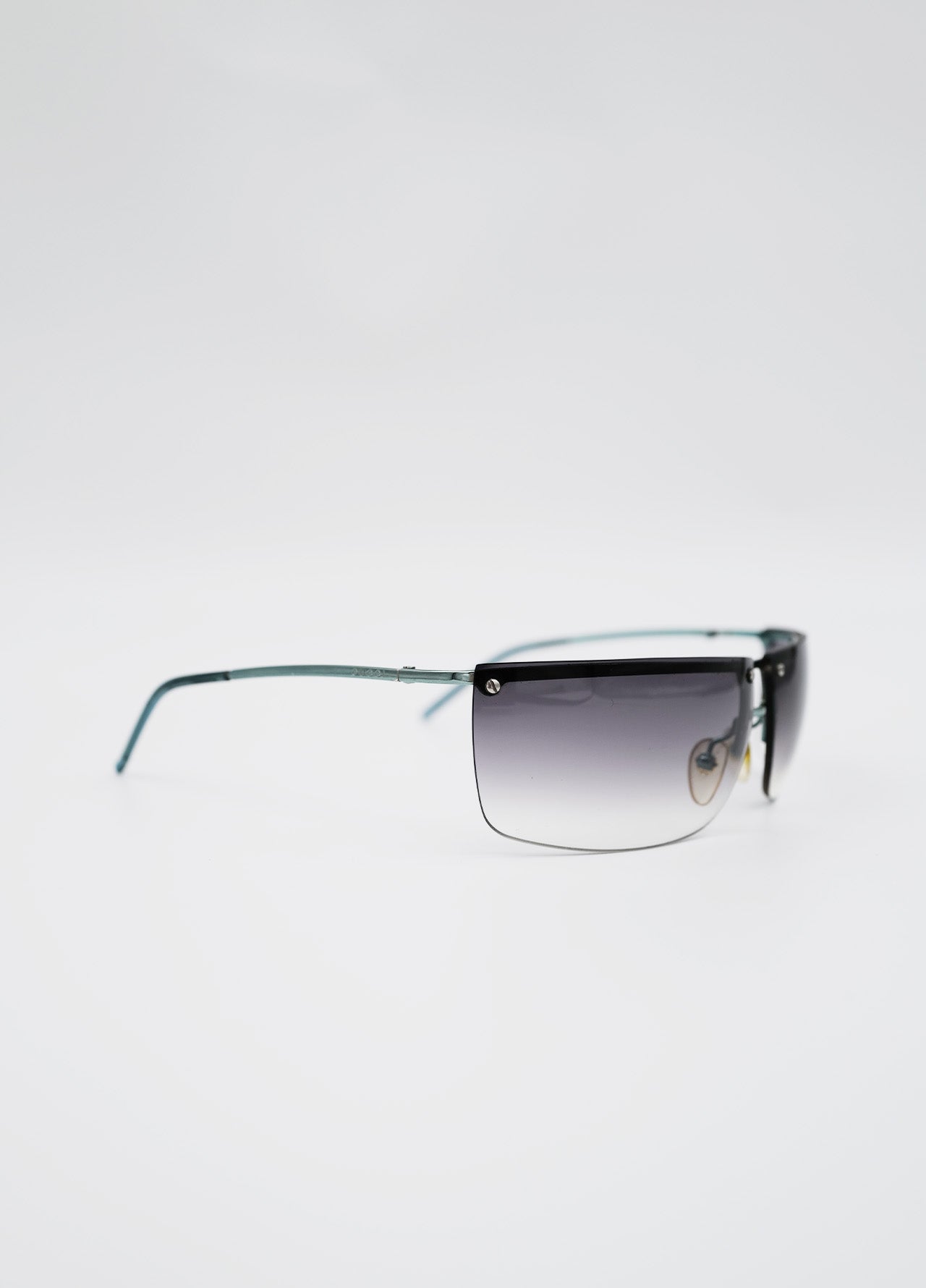 Lunette Gucci Fumée noir et clair, branche en metal